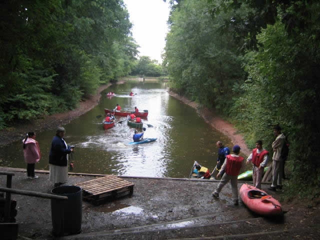 Kayaks and canoes on the river together
